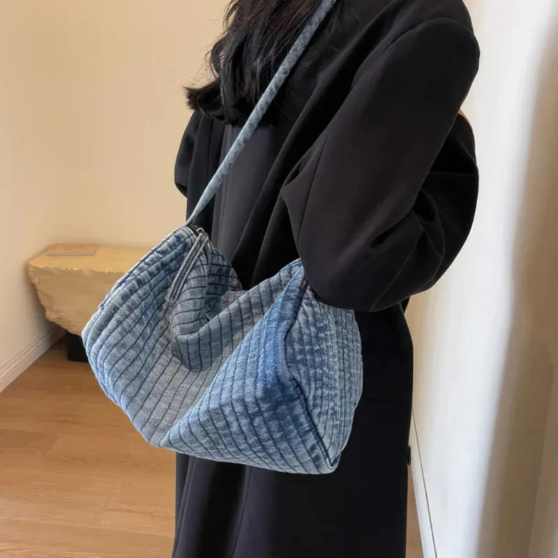 Distressed denim shoulder bag