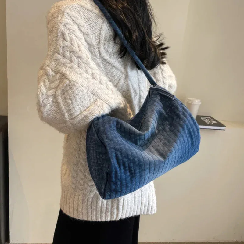 Distressed denim shoulder bag